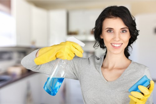 Professional carpet cleaner managing hoses and cables
